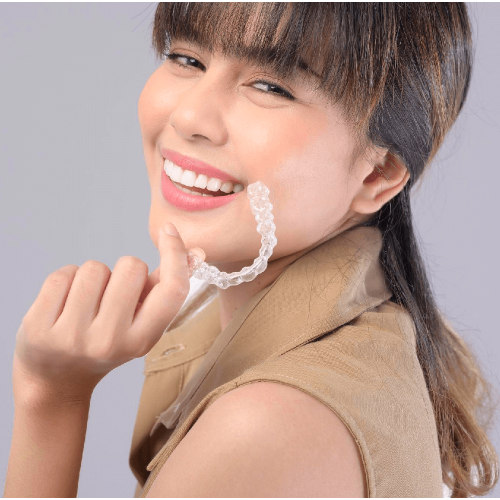 Woman Holding Invisible Braces